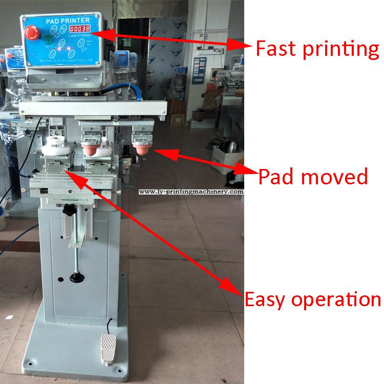 Garment tagless pad printer with pad moved 